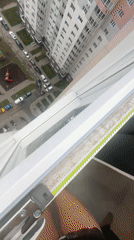 Toddler spotted on building ledge in Moscow