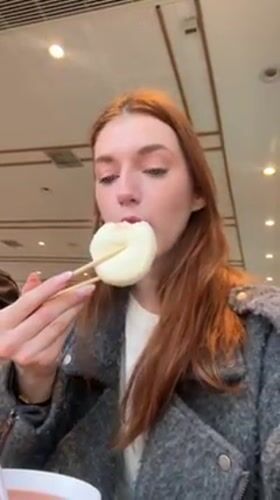 Woman dines at busy fast-food restaurant in Ji Nan