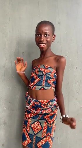 Young person dances joyfully in Badagry, Nigeria
