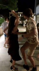 Evening social gathering with dancing captured at unknown venue