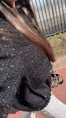 Woman in glittery outfit walks Saint Petersburg street