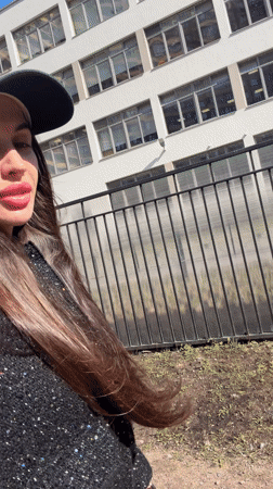 Woman in glittery outfit walks Saint Petersburg street