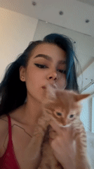 Woman spends afternoon with orange kitten in Moscow area