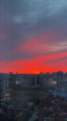 Dramatic red sunset observed over Krasnoyarsk cityscape