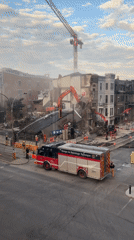 Technical rescue unit on scene as excavators bring down a building