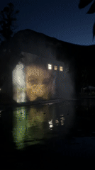 Building projection display reflects in water feature in Vratsa