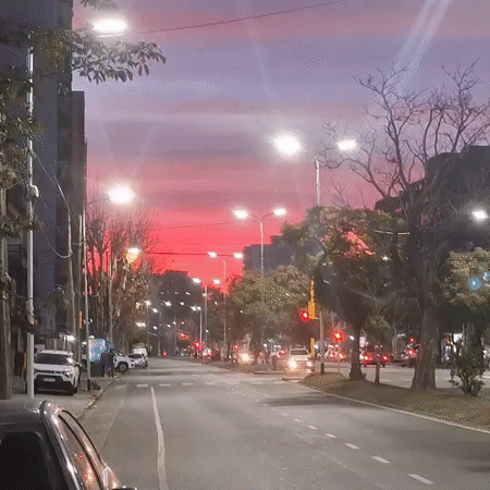 Wilde streets glow under a dramatic pink and purple sunset