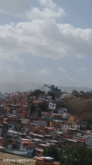 Smoke spotted over hillside neighborhood in Caracas