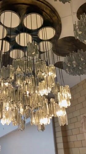 Interior gathering documented in Kyiv building with distinctive chandeliers