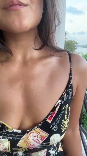 Woman enjoys river balcony view in Kadewatta, Sri Lanka