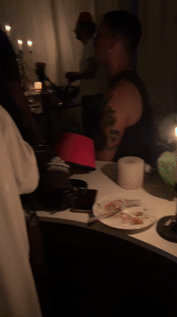 Tel Aviv night: dancing indoors, tabby cat on the balcony