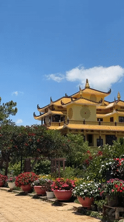 Yellow temple with flowers documented in Da Lat, Vietnam