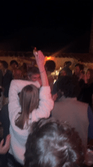 Evening social gathering documented in Lucignano, Italy courtyard