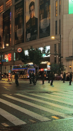 Armored vehicles and uniformed personnel deployed on Shanghai's Nanjing Road