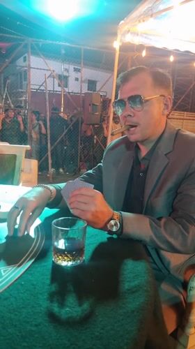 Poker game observed in outdoor setting in Kalamassery