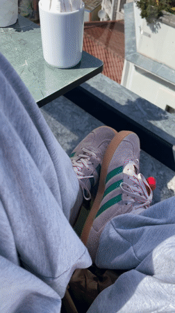 Person relaxes on Istanbul rooftop overlooking Galata Tower