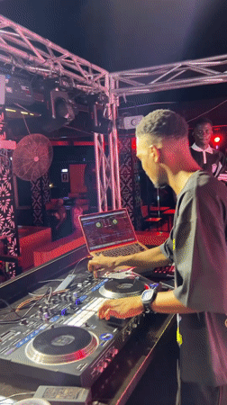 DJ set underway at a nighttime event in Howayi, Nigeria