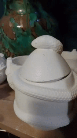 Handmade crafts and ceramic figures browsed at a Wedel shop