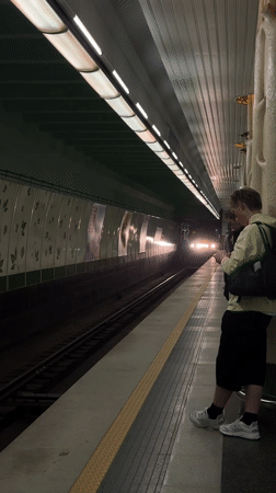 Woman takes selfies on Minsk subway platform as train approaches