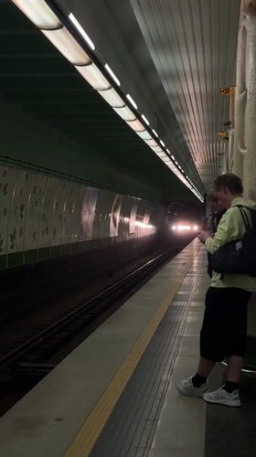 Woman takes selfies on Minsk subway platform as train approaches