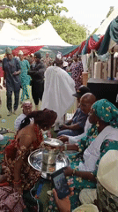 Traditional wedding ceremony celebrated outdoors in Sabon Gari West