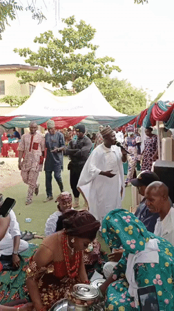 Traditional wedding ceremony celebrated outdoors in Sabon Gari West