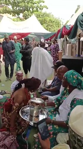 Traditional wedding ceremony celebrated outdoors in Sabon Gari West