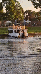 Sunset cruise on the Pärnu waterway, golden hour.