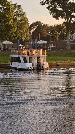Sunset cruise on the Pärnu waterway, golden hour.