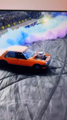 Cars perform burnout demonstrations at track event