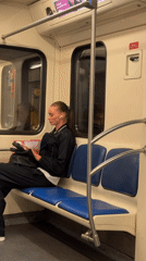 Reading on Moscow subway with book or tablet
