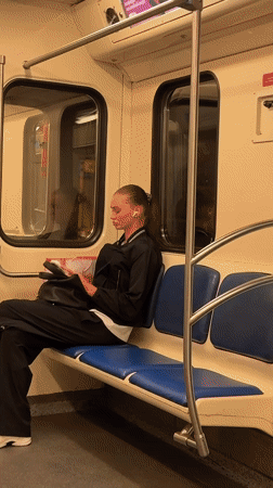 Reading on Moscow subway with book or tablet