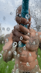 Man washing window outdoors in Pleven, Bulgaria