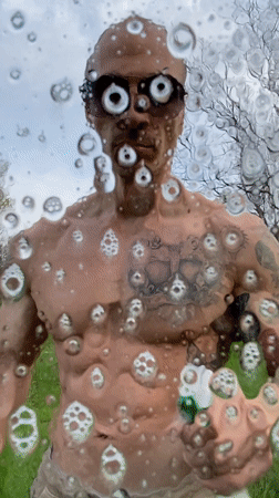 Man washing window outdoors in Pleven, Bulgaria