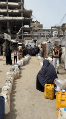 Gaza civilians collect water, shelter in tent camps