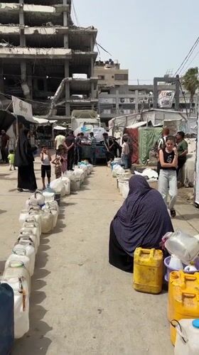 Gaza civilians collect water, shelter in tent camps