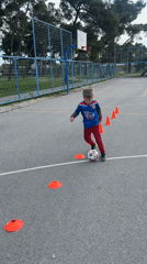 Young boy practices soccer drills on outdoor court in Podgorica