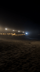 String lights illuminate North Kuta beach in evening scene