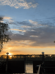 Sunset documented over water in Chaikovsky, Russia