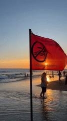 Evening beach activity continues in North Kuta despite swimming warnings