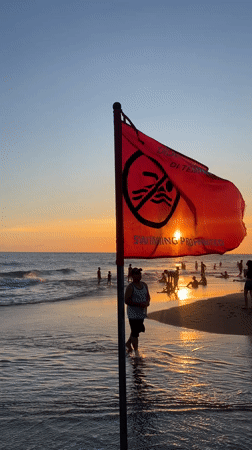 Evening beach activity continues in North Kuta despite swimming warnings