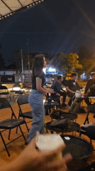Nighttime outdoor gathering lit up in Kecamatan Pati