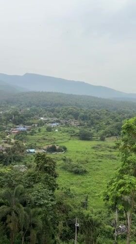 Misty mountain views from a hillside deck in northern Thailand