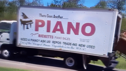 Piano falls from moving truck onto roadway