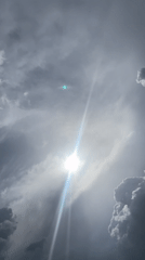 Sun rays pierce through clouds over Jos, Nigeria