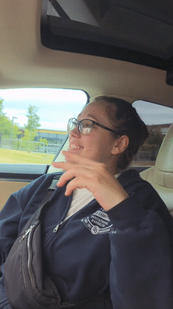 Passenger seat conversation in Tacoma, hands mid-gesture