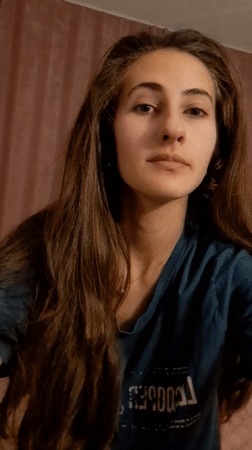 Woman documents skincare routine in Chepintsi, Bulgaria indoor setting