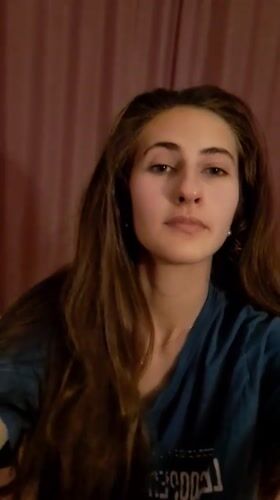 Woman documents skincare routine in Chepintsi, Bulgaria indoor setting
