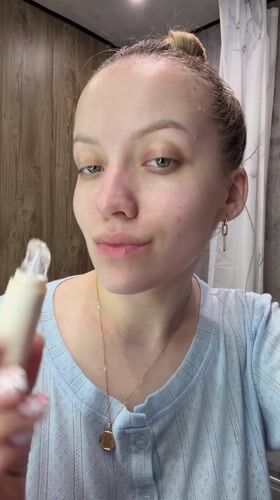 Woman documents evening skincare routine in Russian bathroom