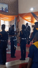 Uniformed ceremony and brass band performance in Kaduna hall